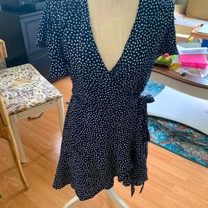 Navy and white polka dot wrap dress